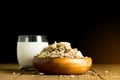 almond milk in glass with almonds in wooden bowl on black background with copy space Royalty Free Stock Photo