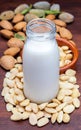Almond milk in glass bottle. Includes peeled almonds.