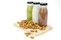 Almond milk in glass bottles with almonds Royalty Free Stock Photo
