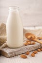 Almond milk, nuts, napkin on a stand Royalty Free Stock Photo