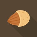 Almond nut emerging from shell on dark brown background Royalty Free Stock Photo