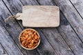 Almond nut in wooden bowl on wood table background, copy space Royalty Free Stock Photo