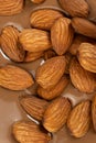 Almond nuts in melted milk chocolate macro Royalty Free Stock Photo