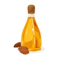 Almond nuts are near glass bottle with yellow oil closed by brown plastic cap. Royalty Free Stock Photo