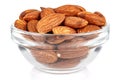 Almond nuts in a small transparent glass round bowl isolated on white background Royalty Free Stock Photo