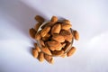 Organic Almond Nuts in a Transparent Glass Bowl On isolated White Background Royalty Free Stock Photo