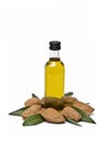 Almond oil bottle and some almonds. Royalty Free Stock Photo