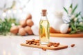 almond oil in a glass bottle with raw almonds Royalty Free Stock Photo