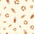 Almond vector seamless pattern background. Light brown clusters of oval nuts on cream color plaid backdrop. Assorted Royalty Free Stock Photo