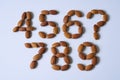 Almonds arranged in numbers 456 789 on white background studio shot nuts Royalty Free Stock Photo