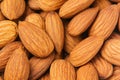 Almonds background. Pile of selected almonds close-up. Royalty Free Stock Photo