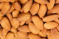 Almonds background. Pile of selected almonds close-up. Royalty Free Stock Photo