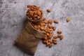 Almonds in bag isolated on grey background Royalty Free Stock Photo