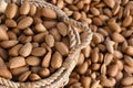 Shelled almonds in a wicker basket