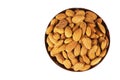 Almonds in brown bowl isolated on the white background. Royalty Free Stock Photo