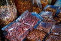 Almonds and cashew nuts in plastic bag at the market. Healthy food. High protein food for fitness or intermittent fasting people. Royalty Free Stock Photo