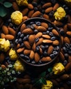almonds and flowers on a black background stock photo
