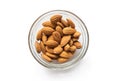 Almonds with a glass plate on a white background Royalty Free Stock Photo