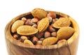 Almonds and nuts in a handmade wooden bowl Royalty Free Stock Photo