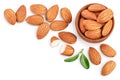 Almonds nuts with leaves isolated on white background with clipping path and full depth of field. Top view with copy Royalty Free Stock Photo