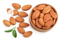 Almonds nuts with leaves in wooden bowl isolated on white background with clipping path and full depth of field. Top Royalty Free Stock Photo