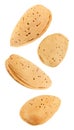 Almonds nuts no split, four pieces soaring, falling, flying isolated on white background with clipping path. Set of parts. Full