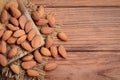 Peeled almond nuts. A heap of raw almonds on a wooden table. Nuts photo. Rustic style. Top view Royalty Free Stock Photo