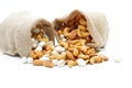 Almonds Pistachio and Cashews in sack on a white background