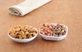 Almonds, Pistachios, Peanuts, and Walnuts Healthy Food in Two Ceramic Trays