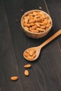 Almonds in plate on light background. Almond nuts. Royalty Free Stock Photo