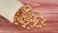 Almonds raw peeled pour from bag