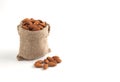Almonds seeds, Almonds in sack isolated on over white background