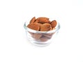 Almonds seeds in glass bowl isolated. Royalty Free Stock Photo