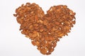 Almonds without their shells, making a heart