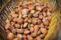 Almonds unshelled nuts in basket, fresh and raw