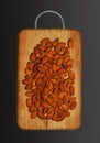 Almonds on a wooden board. Isolated on black background. Top view Royalty Free Stock Photo