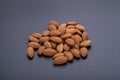 Almonds in wooden bowl on a black background Royalty Free Stock Photo