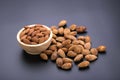 Almonds in wooden bowl on a black background Royalty Free Stock Photo