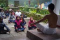 ALMORA, INDIA - SEPTEMBER 02, 2020: Young man wearing a white dhoti taking yoga classes of young kids and older men