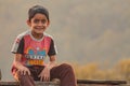 Almora, Uttrakhand, India- May 22 2020: A travel portrait of a young kid smiling looking into the camera