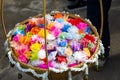 Almsgiving with alms flowers ribbon-flowers for giving alms to make merit in Buddhism religious traditional in Thailand