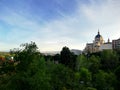 Almudena cathedral from a park with a blue sky in Madrid