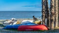 Almunecar, Spain, February 10, 2024. Palm trees and boats on Almunecar beach, in Granada, Spain