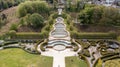 Alnwick gardens from above filled with people and trees