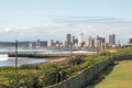 Aloe Plants and Dune Vegetation against City Skyline Royalty Free Stock Photo