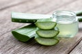 Aloe vera sliced and aloevera gel on wood table background