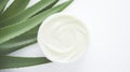 Aloe vera cream with aloe vera leaves on white