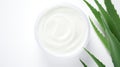 Aloe vera cream with aloe vera leaves on white