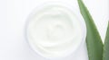 Aloe vera cream with aloe vera leaves on white