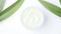 Aloe vera cream with aloe vera leaves on white